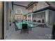 Inviting backyard oasis with a modern pool and lounge area at 15650 Youngblood Rd, Charlotte, NC 28278