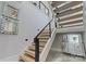 Modern staircase with light wood treads and metal railing at 15650 Youngblood Rd, Charlotte, NC 28278