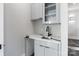 Modern wet bar with quartz countertop and sleek cabinetry at 15650 Youngblood Rd, Charlotte, NC 28278