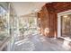 Relaxing sunroom featuring a brick wall and ceiling fan at 158 Tetbury Ne Ave, Concord, NC 28025