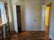 Another bedroom with closet space and a double door at 1608 Carfax Dr, Charlotte, NC 28216