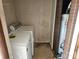 Functional laundry room with a washer and dryer set, along with a water heater at 1608 Carfax Dr, Charlotte, NC 28216