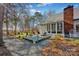 Backyard with a deck and sitting area beside a large grassy space with mature trees at 161 Picwyck Dr, Mooresville, NC 28115