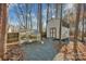 Backyard featuring a storage shed, greenhouse, and gravel pathway at 161 Picwyck Dr, Mooresville, NC 28115