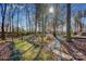 View of the backyard featuring a stone pathway to a shed at 161 Picwyck Dr, Mooresville, NC 28115