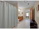 Bright bathroom featuring a wood vanity, neutral walls and a shower curtain at 161 Picwyck Dr, Mooresville, NC 28115