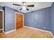 Bedroom featuring hardwood floors, closet, and blue paint at 161 Picwyck Dr, Mooresville, NC 28115