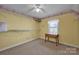 Simple bedroom featuring shelving, a window, and neutral decor at 161 Picwyck Dr, Mooresville, NC 28115