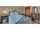 Serene bedroom with a metal bed frame, hardwood floors, and a dresser with a decorative mirror at 161 Picwyck Dr, Mooresville, NC 28115