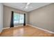 Bedroom with hardwood floors, natural light, and neutral paint at 161 Picwyck Dr, Mooresville, NC 28115