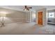 Bright bedroom with carpet, ceiling fan and built-in shelving at 161 Picwyck Dr, Mooresville, NC 28115