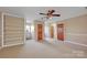 Bedroom with carpet, ceiling fan, and ample closet space at 161 Picwyck Dr, Mooresville, NC 28115