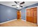 Bedroom with hardwood floors, closet, and blue paint at 161 Picwyck Dr, Mooresville, NC 28115