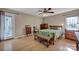 Bright bedroom featuring hardwood floors, ample natural light, and tasteful furnishings for relaxation at 161 Picwyck Dr, Mooresville, NC 28115