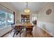 Dining area with wooden table and built-in hutch at 161 Picwyck Dr, Mooresville, NC 28115