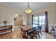 Bright dining area with light wood floors and a traditional dining set at 161 Picwyck Dr, Mooresville, NC 28115