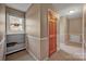 Upper hallway featuring a small window, storage shelves and a doorway at 161 Picwyck Dr, Mooresville, NC 28115