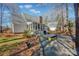 Rear view of house showing deck and sunroom at 161 Picwyck Dr, Mooresville, NC 28115
