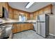 Traditional kitchen with wood cabinets, granite counters, and stainless appliances at 161 Picwyck Dr, Mooresville, NC 28115