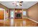 Welcoming living room featuring a brick fireplace and hardwood floors at 161 Picwyck Dr, Mooresville, NC 28115