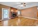 Comfortable living room with brick fireplace, hardwood floors and bright windows at 161 Picwyck Dr, Mooresville, NC 28115