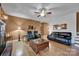 Spacious living room with hardwood floors, comfortable seating, and decorative mirrors for added style at 161 Picwyck Dr, Mooresville, NC 28115