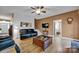 Charming living area boasts hardwood floors, comfortable furnishings, and a conveniently placed TV at 161 Picwyck Dr, Mooresville, NC 28115