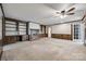 Bright living room with fireplace and built-in shelving at 2209 Kings Dr, Gastonia, NC 28056