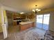 Eat-in kitchen with oak cabinets and sliding glass door at 243 Plyler Rd, Indian Trail, NC 28079