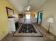 Bright living room featuring a fireplace and access to kitchen at 243 Plyler Rd, Indian Trail, NC 28079