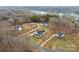 Aerial view showcasing a lakefront home and neighborhood at 243 Reese Wilson Rd, Belmont, NC 28012