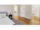 Bedroom with hardwood floors, adjoining bath, and a comfortable bed at 243 Reese Wilson Rd, Belmont, NC 28012