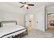 Spacious bedroom with carpeted floor, ceiling fan, and a comfortable bed at 243 Reese Wilson Rd, Belmont, NC 28012
