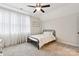 Cozy bedroom with carpeted floor, ceiling fan, and a comfortable bed at 243 Reese Wilson Rd, Belmont, NC 28012