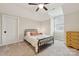 Cozy bedroom with carpeted floor, ceiling fan, and dresser at 243 Reese Wilson Rd, Belmont, NC 28012