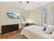 Bright bedroom with hardwood floors, large TV, and a comfortable bed at 243 Reese Wilson Rd, Belmont, NC 28012