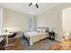 Spacious bedroom with hardwood floors, built-in desk and a comfortable bed at 243 Reese Wilson Rd, Belmont, NC 28012