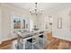 Farmhouse dining room with a wooden table and French doors at 243 Reese Wilson Rd, Belmont, NC 28012