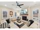 Living room with fireplace, hardwood floors, and large windows at 243 Reese Wilson Rd, Belmont, NC 28012
