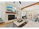 Living room with a fireplace, large TV, and comfortable seating area at 243 Reese Wilson Rd, Belmont, NC 28012