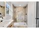 Updated bathroom with walk-in shower and tile surround at 250 Franklin Nw Ave, Concord, NC 28025
