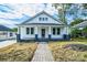Charming white bungalow with brick walkway and porch at 250 Franklin Nw Ave, Concord, NC 28025