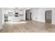 Modern white kitchen with island and stainless steel appliances at 250 Franklin Nw Ave, Concord, NC 28025