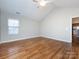 Hardwood floor bedroom with access to kitchen and bathroom at 2748 Polo Club Blvd # 2, Matthews, NC 28105