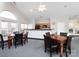 Community kitchen with a breakfast bar and tables with chairs at 2748 Polo Club Blvd # 2, Matthews, NC 28105