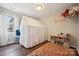 Charming bedroom with stylish carpet, whimsical decor and large, bright window at 3834 Sipes Ln, Charlotte, NC 28269