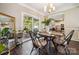 Dining area with natural light and sliding glass door to outdoor seating area at 3834 Sipes Ln, Charlotte, NC 28269