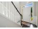 Sunlit entryway features a white front door and staircase at 3834 Sipes Ln, Charlotte, NC 28269