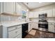 Bright kitchen features white cabinetry, stainless steel appliances, and light countertops at 3834 Sipes Ln, Charlotte, NC 28269