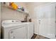 Laundry room features a washer, dryer, and storage shelves at 3834 Sipes Ln, Charlotte, NC 28269